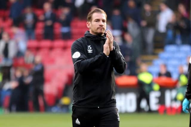 Huddersfield Town manager Jan Siewert applauds the fans after the Terriers' Premier League relegation is confirmed at Selhurst Park on Saturday. Picture: Isabel Infantes/PA.