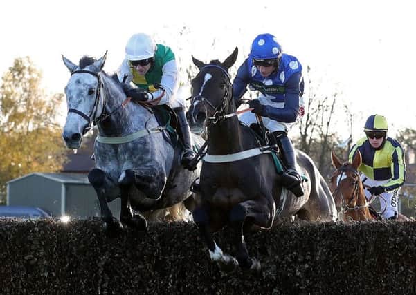 Vintage Clouds and Danny Cook (left) are guaranteed a place in the Grand National line-up this weekend.