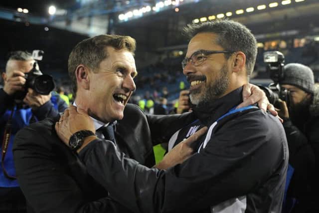 MAGIC MEMORIES: Dean Hoyle celebrates with manager David Wagner after getting to the Championship play-off final at Wembley. Picture: Tony Johnson.
