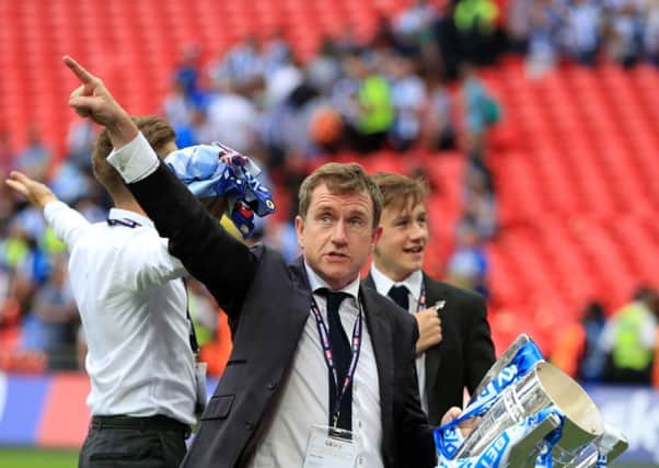 OPTIMISTIC: Huddersfield chairman Dean Hoyle celebrates with the trophy after after winning the Sky Bet Championship play-off final at Wembley Stadium, London. PRESS ASSOCIATION Photo. Picture: Mike Egerton/PA