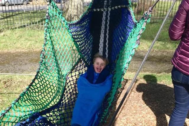 Henry Craven heads down slide at Treetop Nets