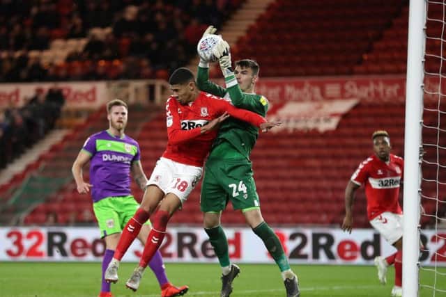 Middlesbroughs Ashley Fletcher is denied in an aerial duel by Bristol City goalkeeper Max OLeary in Tuesday nights Championship game (Picture: Martin Rickett/PA Wire).