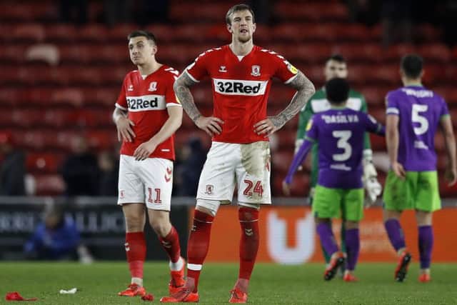 Middlesbrough's Aden Flint (right) and Jordan Hugill (left) show their frustration on Tuesday night. Picture: Martin Rickett/PA.