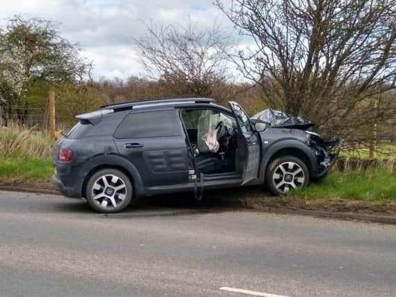 A man has been arrested after a Citroen crashed into a parked police van on Otley Road