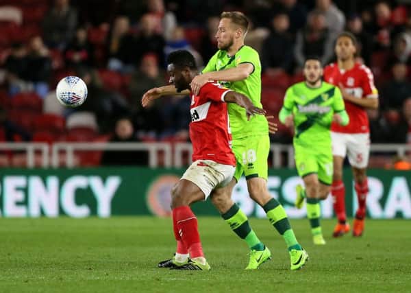 Middlesbrough's John Obi Mikel (left) and Bristol City's Marco Stiepermann (right) battle for the ball during the Sky Bet Championship match at the Riverside Stadium, Middlesbrough (Picture: PA)
