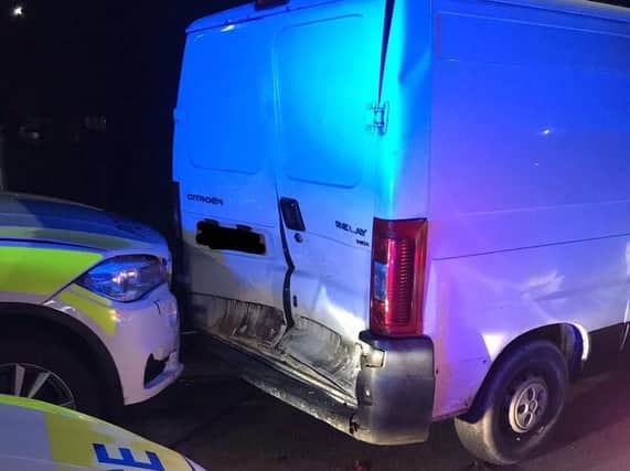 Thieves reverse stolen van into police car injuring two officers. Photo credit: Humberside Police.