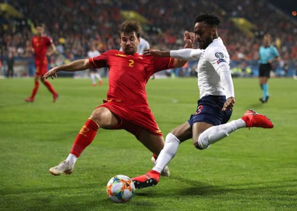 England's Danny Rose takes on Montenegro's Filip Stojkovic  during last month's Euro 2020 Qualifying, Group A match in Montenegro (Picture: Nick Potts/PA Wire).