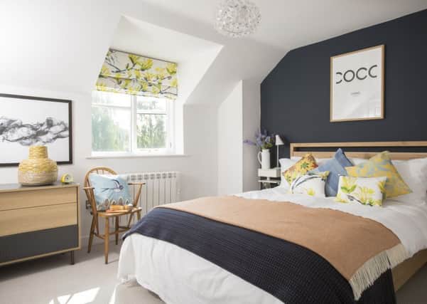 The bedroom with Farrow and Ball's Hague Blue on the wall behind the bed.