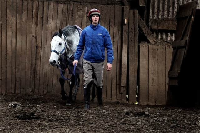 Stable lad Reece Jarosiewicz with Grand National hopeful Vintage Clouds.