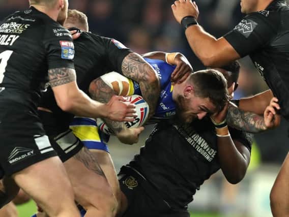 Hull FC defenders struggle to bring down Warrington's Daryl Clark in last week's record home defeat.