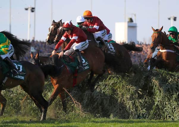 Tiger Roll ridden by jockey Davy Russell (centre) jumps a fence the Randox Health Grand National Handicap Chase during Grand National Day of the 2019 Randox Health Grand National (Picture: PA)