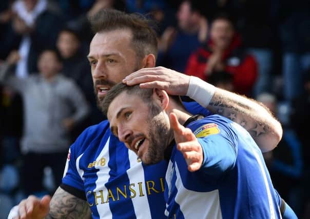 Back with a bang: Gary Hooper, right, celebrates with Steven Fletcher.