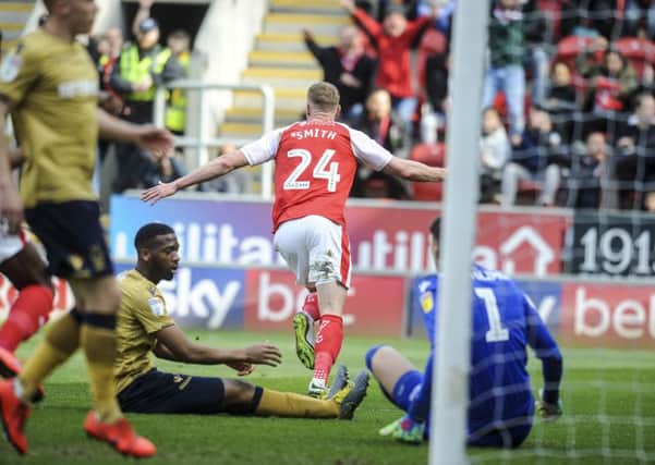 Get in: Rotherham's Michael Smith slots home the opener at New York Stadium. Picture: Dean Atkins
