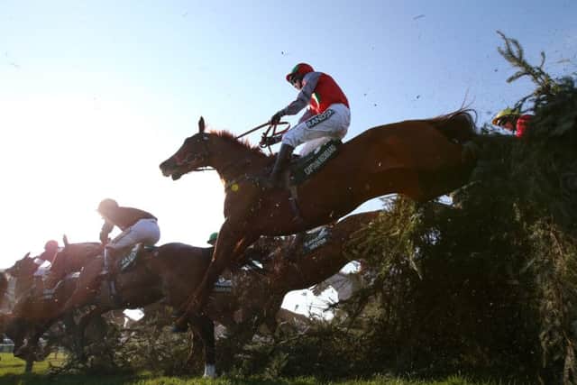 Sam Coltherd and Captain Redbeard clear The Chair in the Grand National.