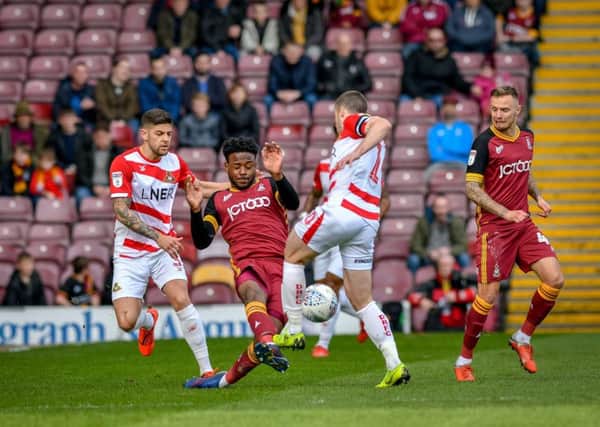 Bradford City's  Jermaine Anderson battles for possession at Valley Parade. Picture: Andy Garbutt