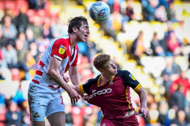 Bradford City's Eoin Doyle comes under pressure. Pictures: Andy Garbutt.