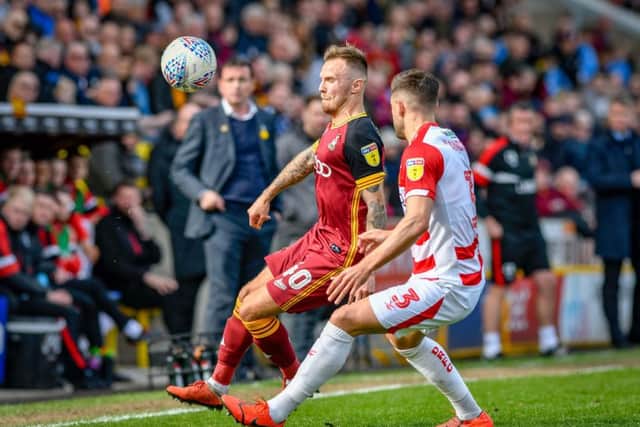 TIGHT TUSSLE: Bradford City's David Ball and Doncaster Rovers' Danny Andrew battle for possession at Valley Parade on Saturday.