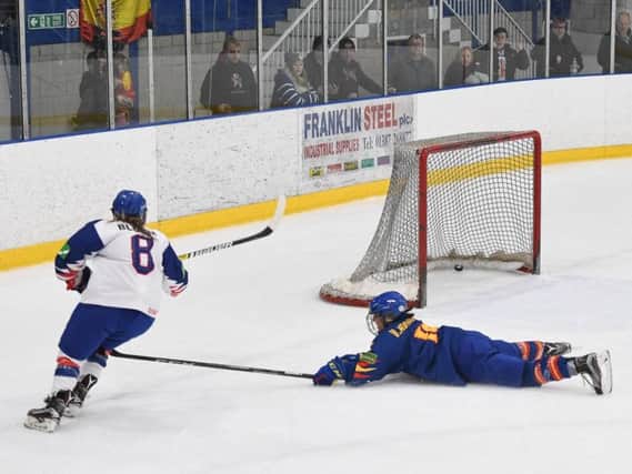 Jodie Bloom, left, rounds off the scoring to make it 4-1 against Spain by scoring an empty-netter in the final minute. Picture: Karl Denham.