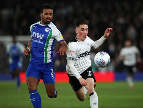 Wigan Athletic's Nathan Byrne and Derby County's Harry Wilson battle for the ball during the Sky Bet Championship match at Pride Park, Derby. Picture: PA