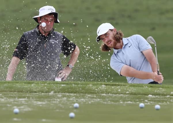 Tommy Fleetwood works on his bunker shots at the practice range ahead of the Masters at Augusta National (Picture: Curtis Compton/Atlanta Journal-Constitution via AP).
