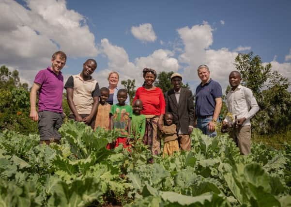 Farmers Simon Kundu and Mary Nafula, with Adam Bedford and Rachel Hallos from the National Farmers' Union and Sir Peter Kendall, chairman of the Agriculture and Horticulture Development Board, with the farmers' eldest son Moses (far right) and their other children on their farm in Saboti, Trans Nzoia county, western Kenya. Picture by Farm Africa/Esther Mbabazi.