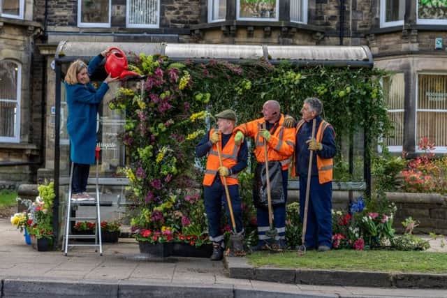 Pictured Sarah Richardson, from Leafy Coulture Flowers, dressing the bus shelter watched by Joseph Lucas, John Leaham, and Steve Matcalfe, from Harrogate Borough Council Parks Department.
