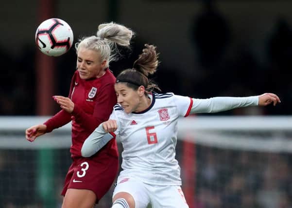 England's Alex Greenwood battles in the air with Spain's Vicky Losada during the international friendly in Swindon (Picture: Bradley Collyer/PA Wire).