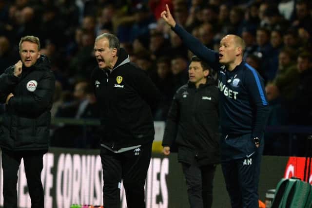 Leeds United head coach Marcelo Bielsa tries to get his message across at Deepdale with Preston boss and Alex Neil, right, doing the same. Picture Bruce Rollinson