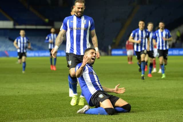 Marco Matias slides on his knees after scoring the first of his two goals in Sheffield Wednesdays win over Nottingham Forest at Hillsborough on Tuesday night (Picture: Steve Ellis).