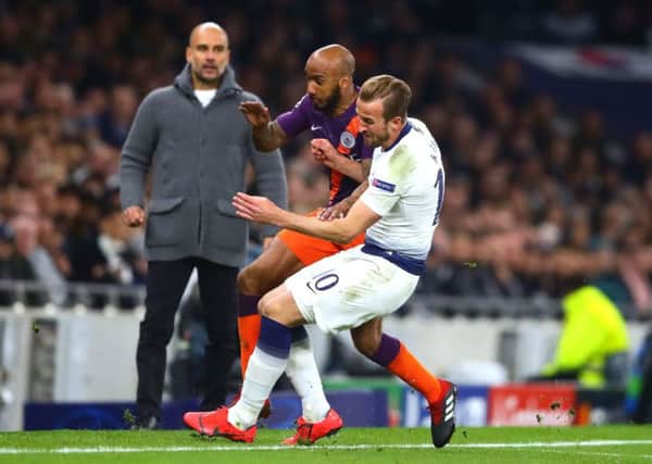 Tottenham's Harry Kane battles with Manchester City's Fabian Delph, in an incident which resulte in an injury for the England striker. Picture: PA