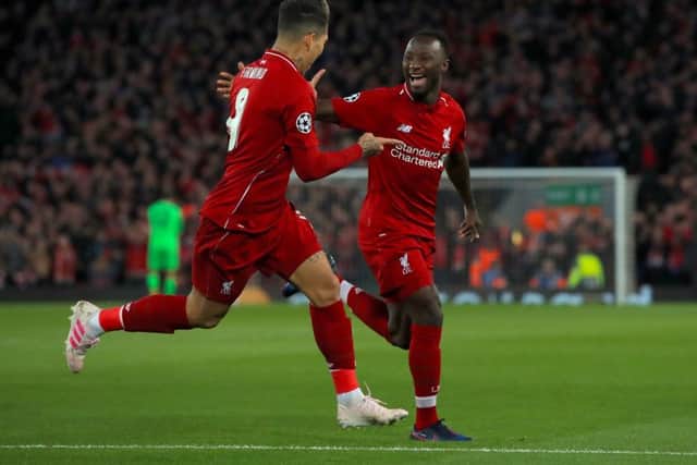 Liverpool's Naby Keita (right) celebrates scoring his side's first goal against Porto. Picture: Peter Byrne/PA