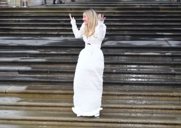 Where's the groom? Singer Ellie Goulding wears bridal white in this '80s-inspired gown by Adriana Degreas, as she arrives for the premiere of Netflix's 'Our Planet' at the Natural History Museum in Kensington, London, hosted by Sir David Attenborough. Picture: Kirsty O'Connor/PA Wire
