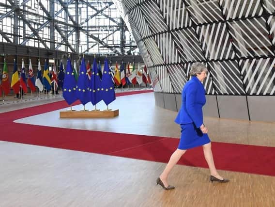 Theresa May arrives at the European Council in Brussels. Credit: Stefan Rousseau/PA Wire