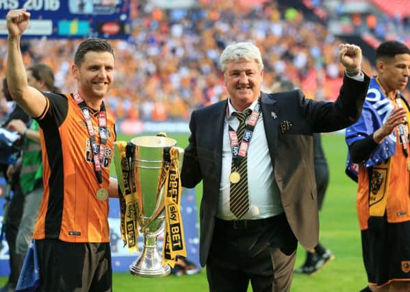 Hull City manager Steve Bruce, right, and his son Alex celebrate after the Championship play-off final win at Wembley in May 2016 (Picture: Nigel French/PA Wire).