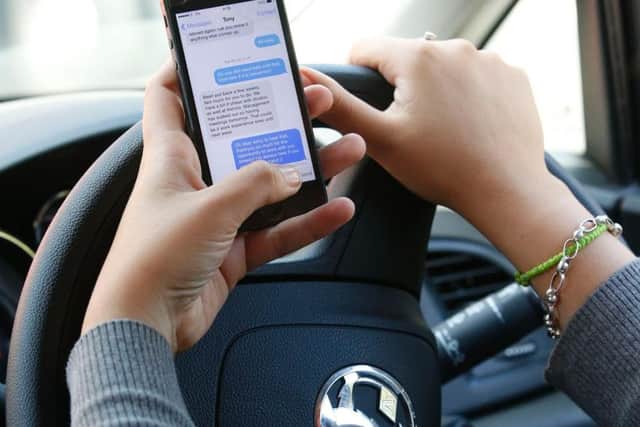 When the device spots a phone being used, it will flash a mobile phone symbol at the vehicle to advise the driver to stop using their mobile phone. (Jonathan Brady/PA Wire).