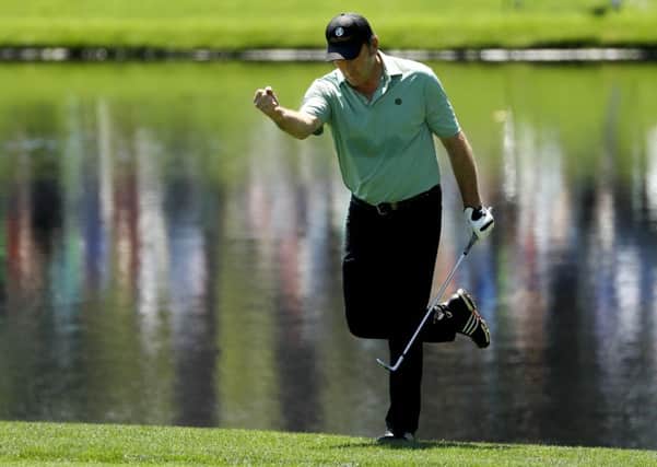 Hero: Nick Faldo reacts after making a birdie on the third hole during the par-3 tournament at the Masters.