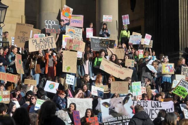 Students and young people take part un the the first ever UK-wide Youth Strike 4 Climate,  protest in Leeds at Leeds Town Hall. Picture Tony Johnson.