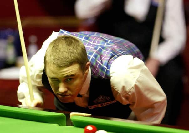 Scotland's Stephen Hendry at the table during his semi-final match against Ronnie O'Sullivan (background) in The 2004 Embassy World Snooker Championships at The Crucible Theatre, Sheffield (Picture: Gareth Copley/PA)