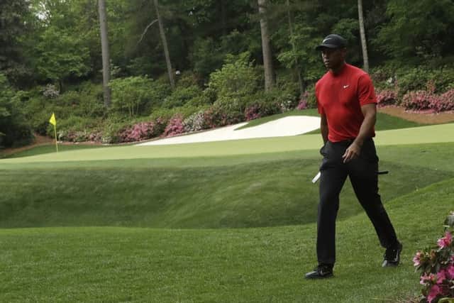 Tiger Woods walks to the 14th hole during the final round for the Masters golf tournament, Sunday, April 14, 2019, in Augusta, Ga. (AP Photo/Marcio Jose Sanchez)