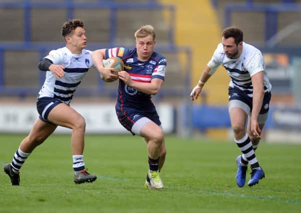 Doncaster Knights' Cameron Cowell runs between Carnegie's Sam Wolstenholme and Andrew Forsyth. (Picture: Tony Johnson)