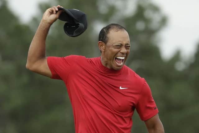 Tiger Woods reacts as he wins the Masters golf tournament Sunday, April 14. (AP Photo/Chris Carlson)