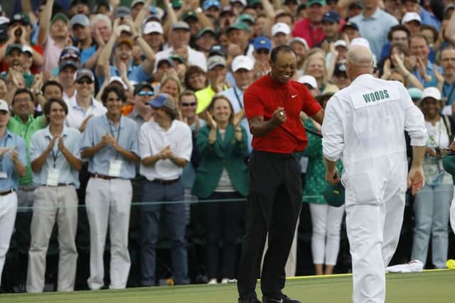 Tiger Woods reacts with his caddie Joe LaCava as he wins the Masters. (AP Photo/Matt Slocum)