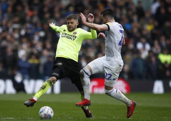 Sheffield United's Martin Cranie battles with Leeds United's Jack Harrison oduring the recent meeting at Elland Road. Picture: Simon Bellis/Sportimage