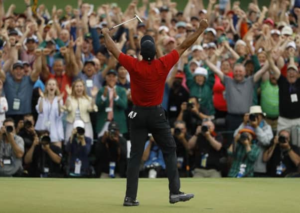 Tiger Woods reacts as he wins the Masters.