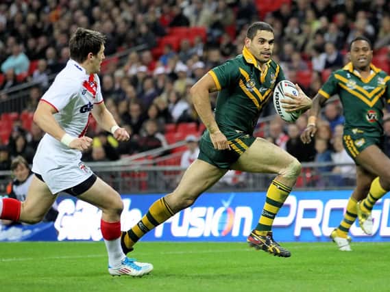 Australia's Greg Inglis evades England's Gareth Widdop in the 2011 Four Nations at Wembley (SWPix)