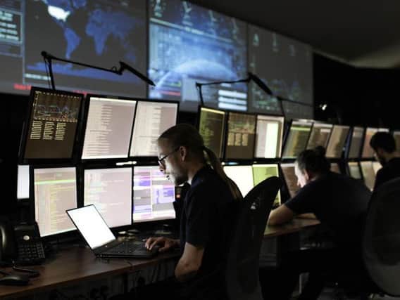 A cyber security research analyst at the ECSC Security Operations Centre 
in Bradford