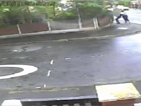 The attack in the Levenshulme area of Manchester was caught on CCTV