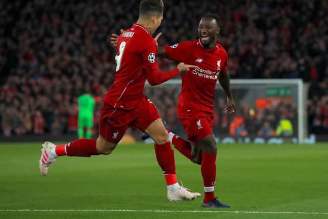 Liverpool's Naby Keita (right) celebrates scoring his side's first goal of the game against Porto in the first leg with Liverpool's Roberto Firmino . Picture: Peter Byrne/PA