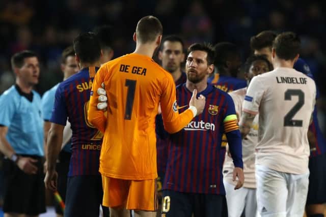 HARD LINES: Barcelona forward Lionel Messi greets Manchester United goalkeeper David de Gea at the end of the game. Picture: AP/Joan Monfort
