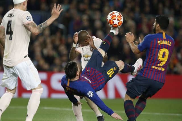 Barcelona forward Lionel Messi tries to score with a bicycle kick at the Nou Camp last night. Picture: AP/Joan Monfort
